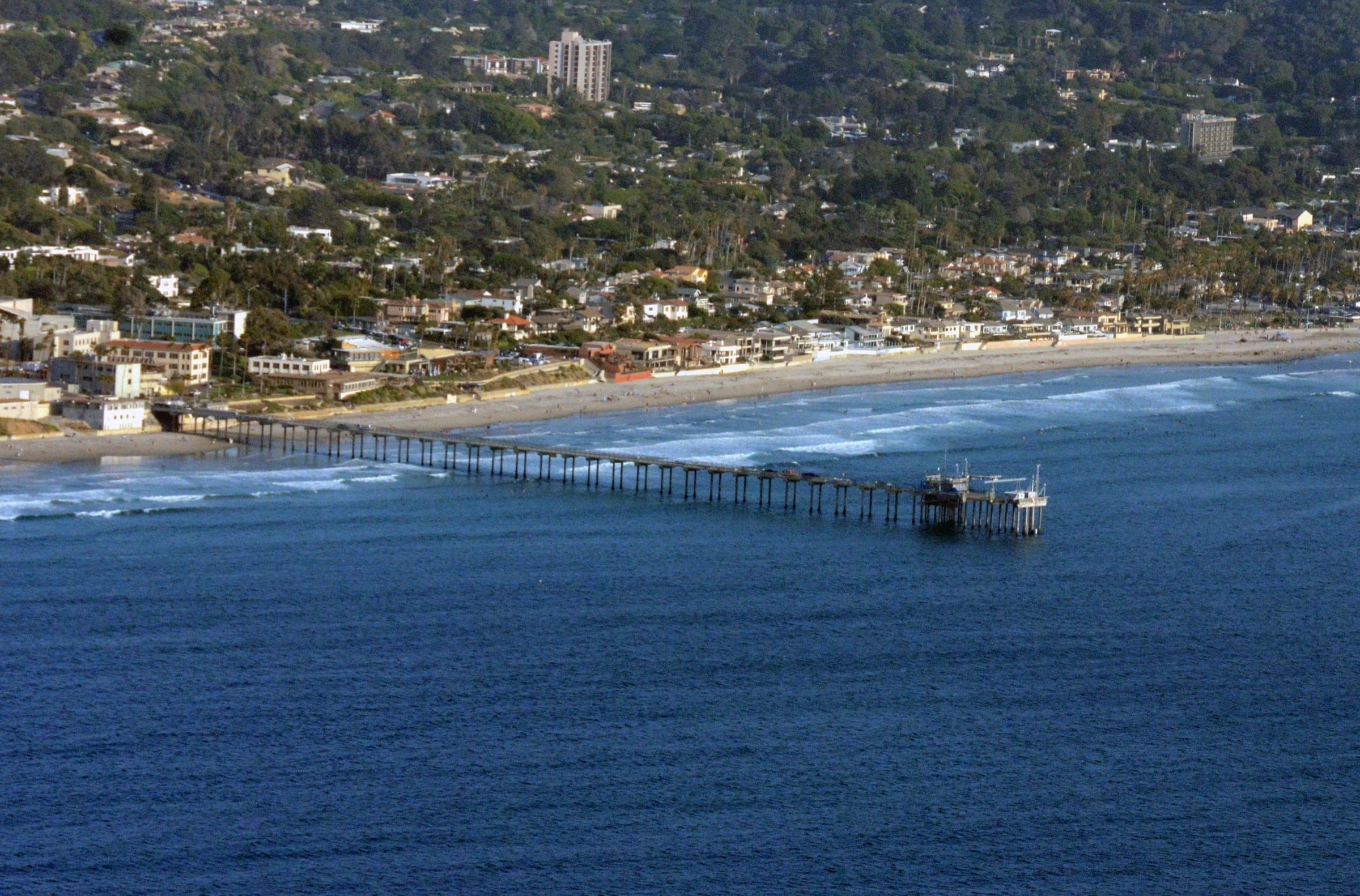 Scripps Pier and La Jolla Shores beach with homes climbing the hillside above